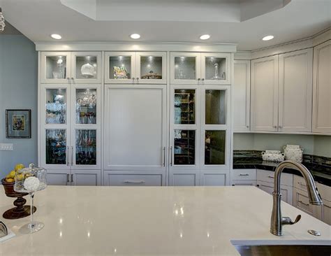 Update your kitchen cabinets with glass insert doors. Transitional Gray Kitchen Remodel - Home Bunch Interior ...