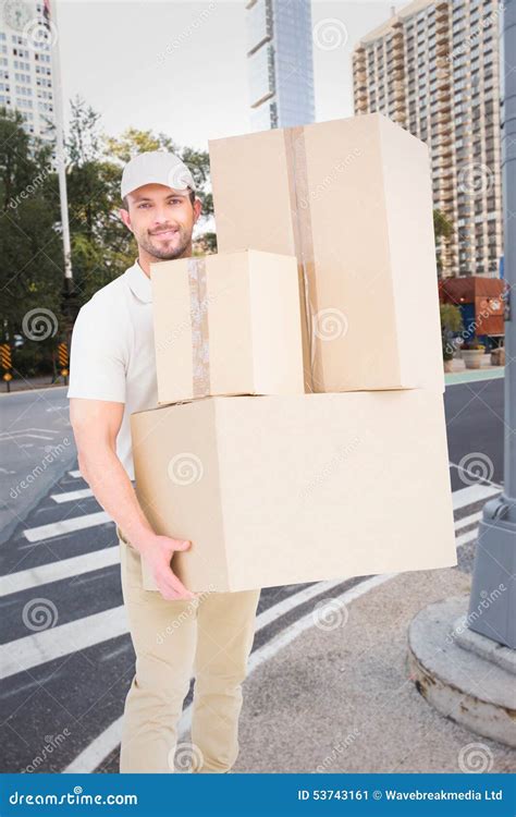 Composite Image Of Delivery Man Carrying Cardboard Boxes Stock Image