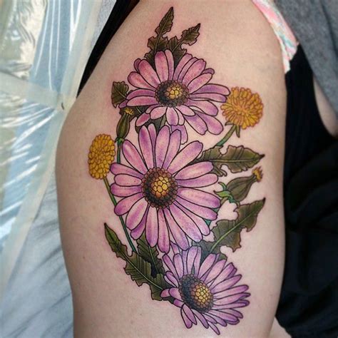 The shoulder daisy tattoo contains around five daisy flowers made with black and gray color combination. 125+ Daisy Tattoo Ideas You Can Go For + Meanings - Wild ...