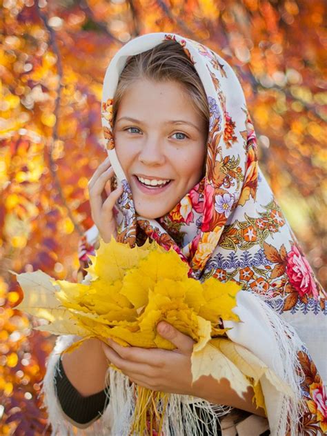 a pretty girl in a russian pavlovsky posad shawl the shawl is called along the riverside