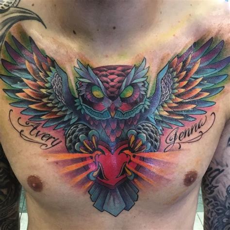 An Owl With Wings On His Chest Is Shown In This Tattoo Artists Photo