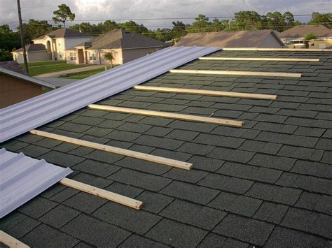 Installing metal roofing panels over shingles. Can you install a metal roof over shingles? Absolutely ...