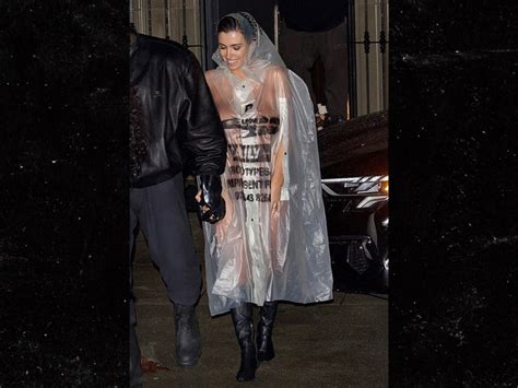 Bianca Censori Goes Naked Under Sheer Raincoat For Outing With Kanye