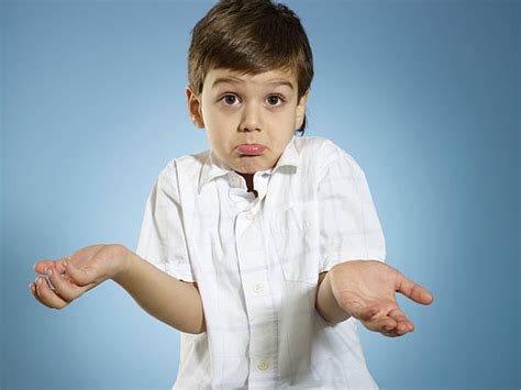 Royalty Free Confused Child Shrugging Shoulders Pictures Images And