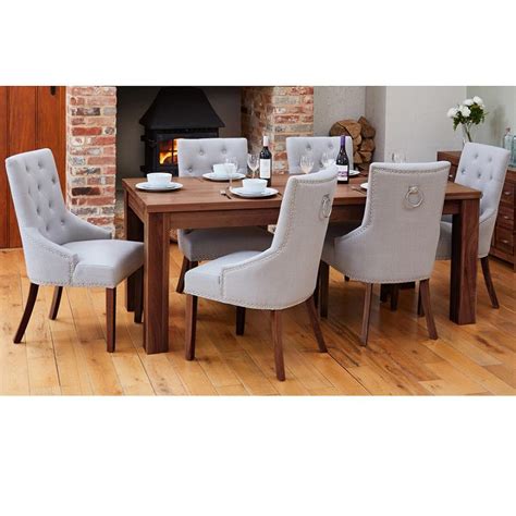 The stanmore dining chair is an elegant fan backed chair finished in a subtle ivory lacquer with a taupe upholstered seat pad. Modern Walnut Extending Dining Table with 6 Grey Accent ...