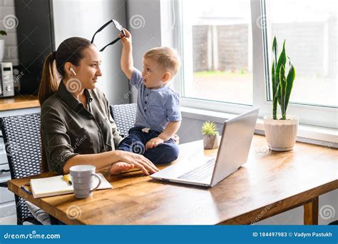 Young Mother Works From Home With Laptop Stock Image Image Of