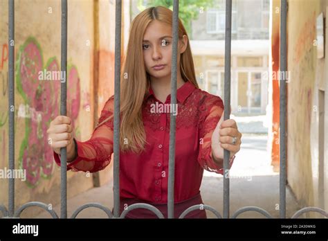beautiful woman behind bars Stock Photo - Alamy