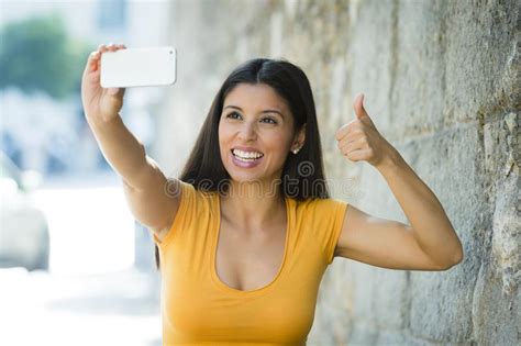 Attractive And Sweet Latin Woman Smiling Happy Taking Self Portrait Selfie Photo With Mobile