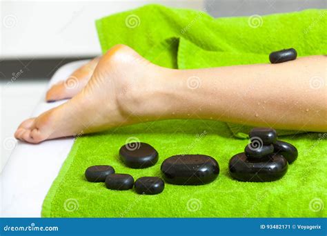 woman having legs massage with hot stones stock image image of body skin 93482171