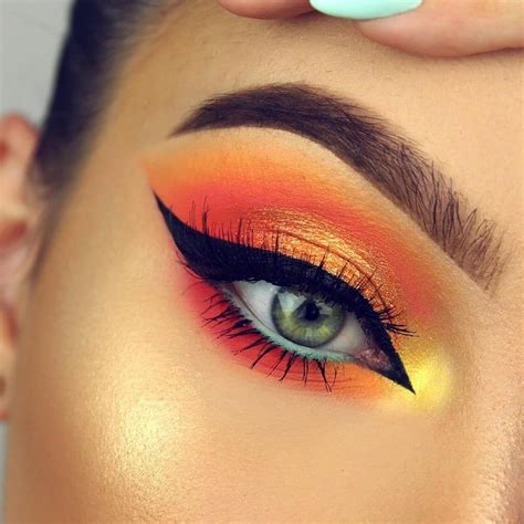 Orange Neon Eye Makeup With A Pop Of Yellow In The Inner Corner Eye