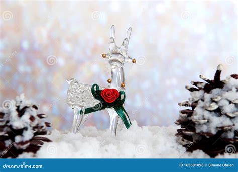 Glass Reindeer On Snow With Pine Cones Stock Photo Image Of