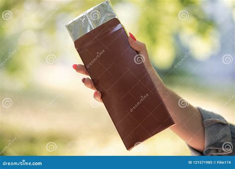 Hand Holding Chocolate Stock Image Image Of Calories 121571985