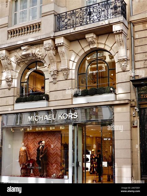 Front Facade Of Michael Kors Shop In Classic Parisian Building On Rue