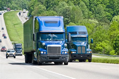 Two Big Blue Trucks On A Highway Stock Image Image 46758277