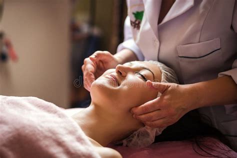 Calm Girl Having Spa Facial Massage In Luxurious Beauty Salon Stock Image Image Of Head Clean