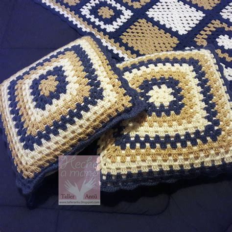 Two Crocheted Squares Sitting On Top Of Each Other In Blue And Yellow