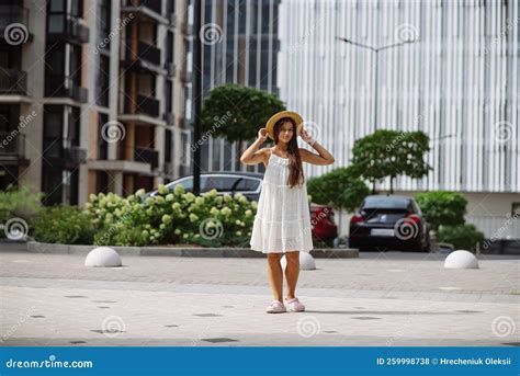 Beautiful Pretty Woman In White Dress Walking At City Street Stock