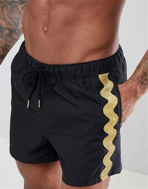 Asos Design Asos Design Swim Shorts In Black With Gold Side Tape Short Length Swim Shorts
