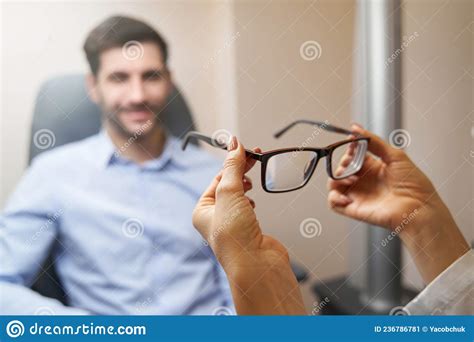 optometrist bringing pair of glasses to patient stock image image of hospital specialist