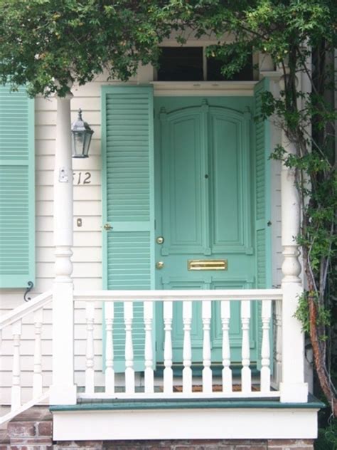 Porch with turquoise door and windows. White house and railings, turquoise front door and shutters | Aqua front doors, Doors, Front ...