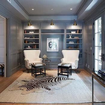 Style is another consideration, and with a small tv room you can try out fun themes and styles that move away from the one used in the rest of the home. Gray Den with Layered Rugs, Transitional, Den/library/office | Home office design