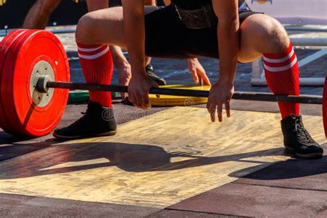 Powerlifter Preparing For Deadlift Of Barbell During Competition Of