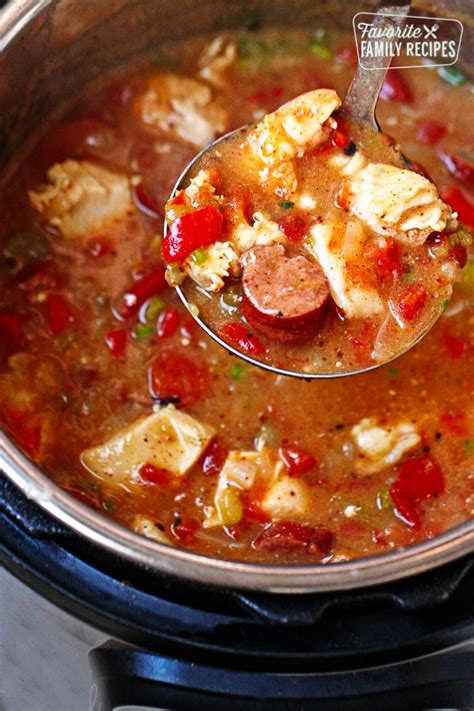 Instant Pot Gumbo With Sausage Chicken And Shrimp Being Scooped From