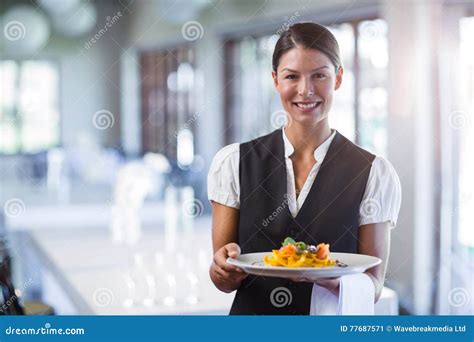 Waitress Holding Plate Of Meal In A Restaurant Stock Image Image Of