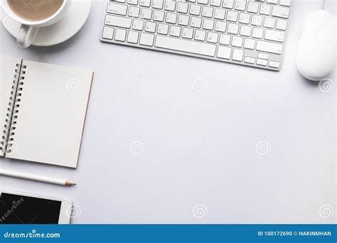 Top View Modern Office Desk Table With Copy Space In White Stock Photo