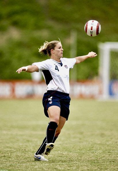 The previous stage is singapore. Cat Reddick #4 of the USA heads the ball during the game ...
