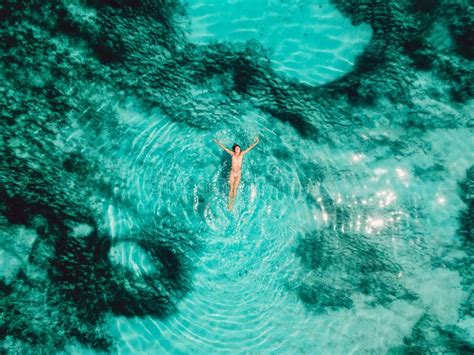 Naked Woman Floating And Relax In Turquoise Ocean Aerial View Stock Photo Image Of Blue Bali