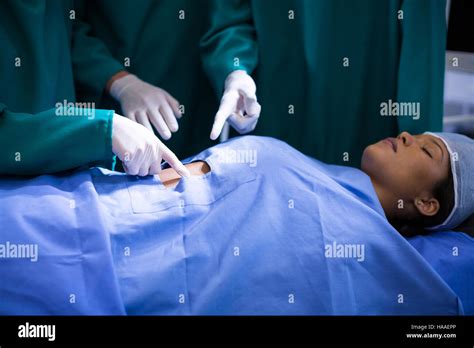 Surgeons Performing Operation In Operation Theater Stock Photo Alamy
