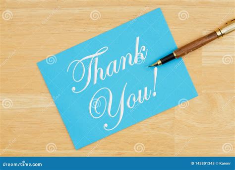 Thank You Blue Greeting Card With A Pen On Textured Wood Stock Image