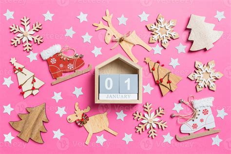 Top View Of Calendar Pink Background Decorated With Festive Toys And