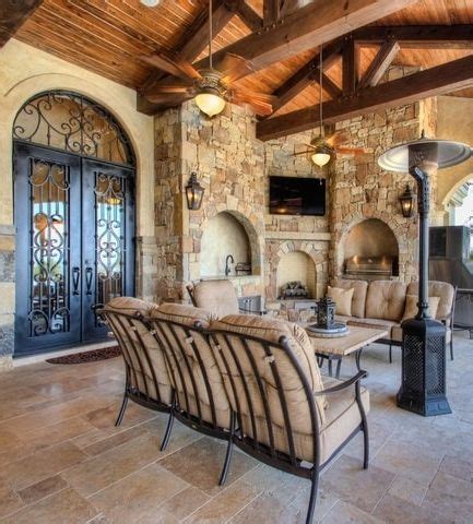 It was custom carved by estrella custom stone. Tuscan outdoor living space with open beams, arched ...