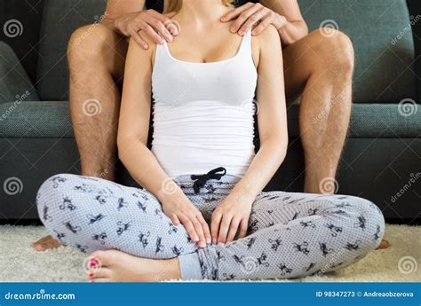 Beautiful Wife Leaning Over Her Cheerful Husband Royalty Free Stock Image