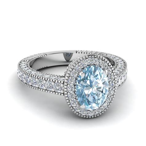 Available in colours that range from pale blues to dark bluish greens, aquamarine gems are usually flawless, meaning even larger stones look spectacular. Vintage Oval Shape Aquamarine Halo Engagement Ring In 950 Platinum | Fascinating Diamonds
