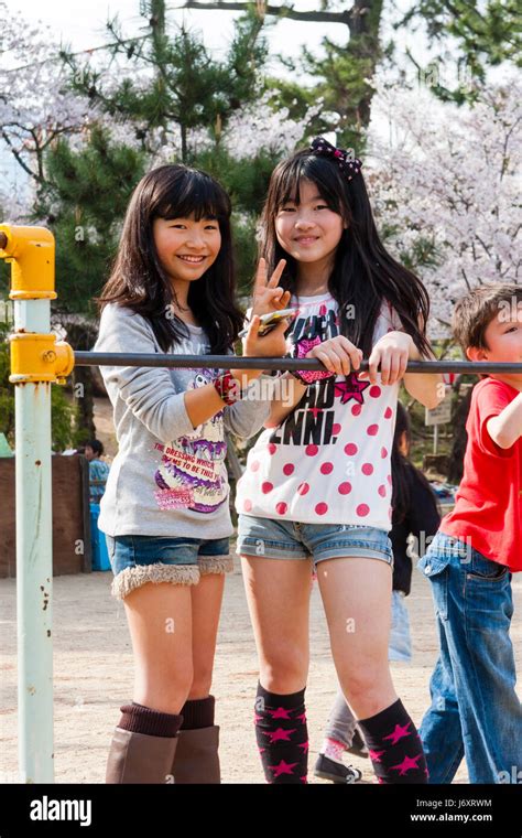 Japan Shukugawa Two Pre Teen Japanese Girls In T Shirts And Cut Stock