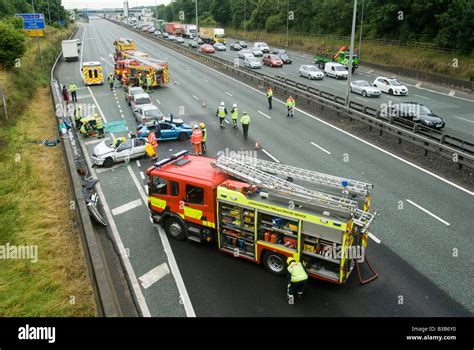 Emergency Services Attending A Nasty Road Traffic Accident On A Motorway As Traffic Tails Back