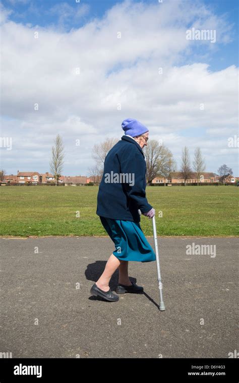 Ninety Year Old Lady Walking In Park England Uk Stock Photo Alamy