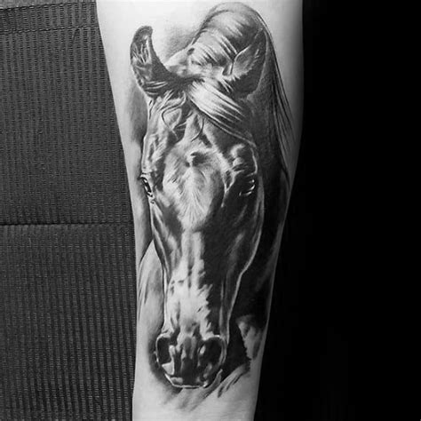 A Black And White Photo Of A Horse Tattoo On The Left Arm With Its