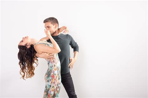 premium photo social dance bachata salsa kizomba zouk tango concept man hugs woman