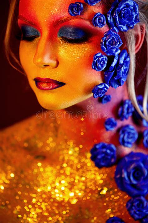 Portrait Of Young And Attractive Woman With Art Makeup Fiery Colors