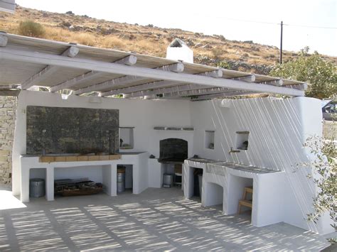 Open Air Kitchen With Bbq Spot Oven And Marble Sink Concrete Counters