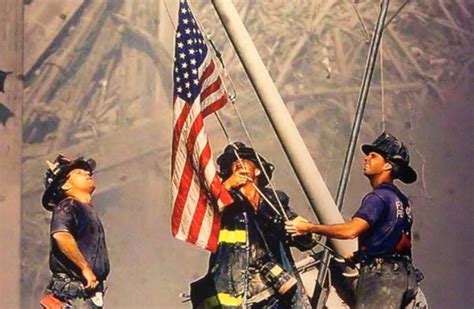 ‘raising The Flag At Ground Zero Is A Photograph By