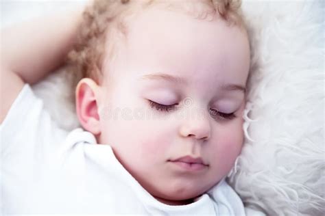 Close Up Baby Boy With Curls Sleeps Calmly Stock Photo Image Of