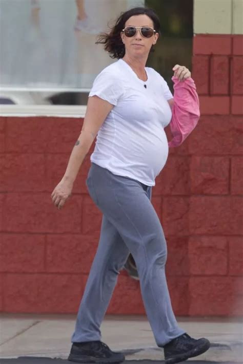 Pregnant Alanis Morissette Bumps Along In See Through White Tee During