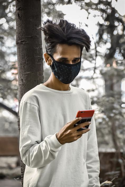 Boy Using Phone While Wearing Mask Pixahive