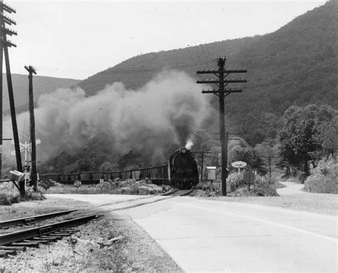 Black And White Photograph Of Steam Coming Out Of Train Engine On