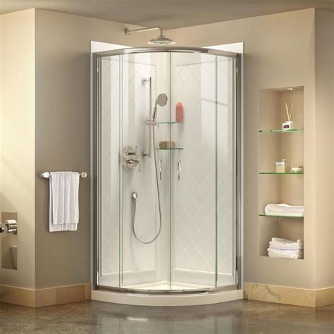 A Bathroom With A Corner Shower Stall And White Towels On The Shelfs Next To It